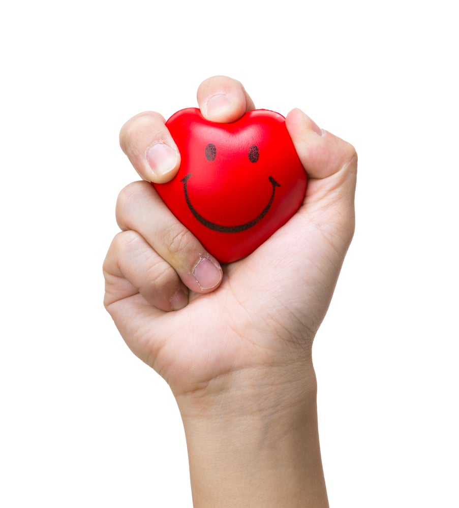 Hand squeezing a stress ball