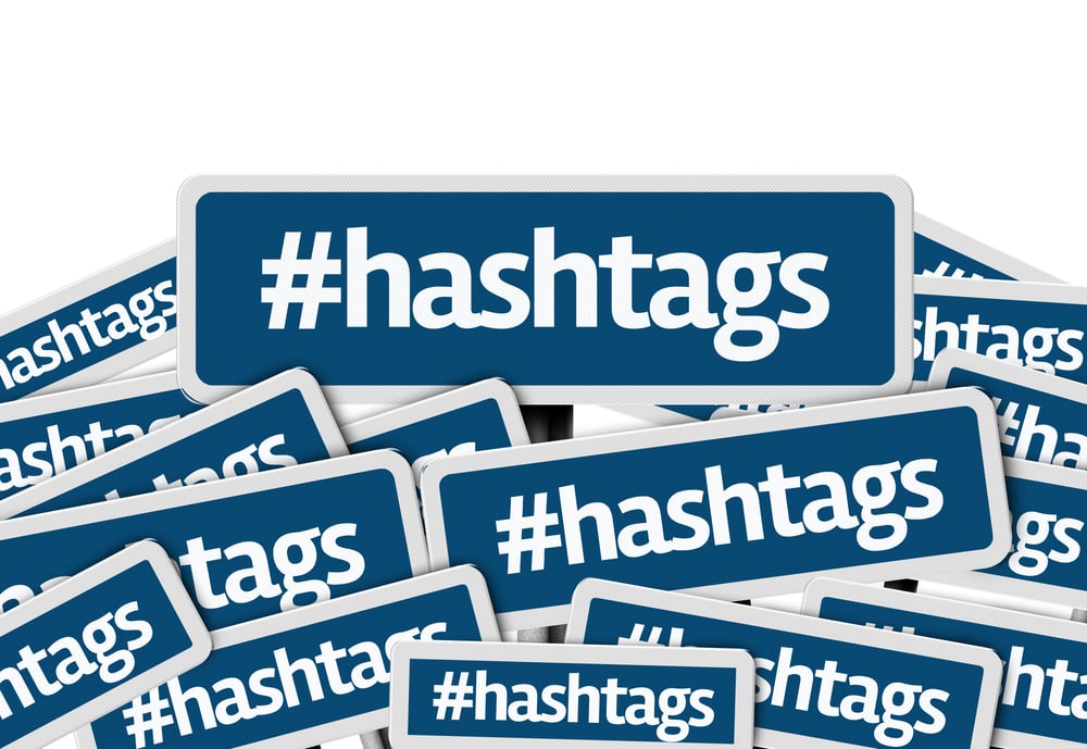 Hashtags written on multiple blue road sign-1