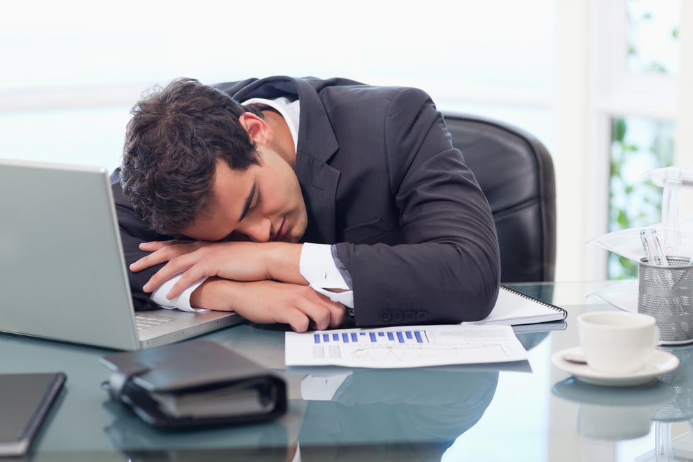 Tired businessman sleeping in his office-1