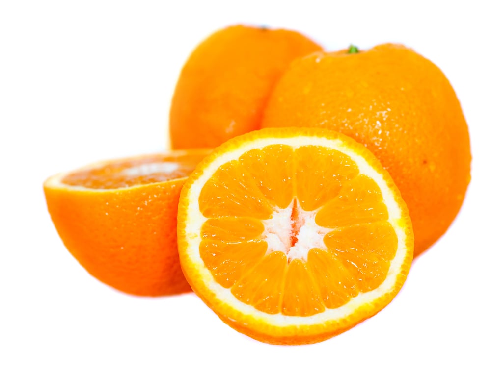 delicious oranges close up showing the texture - isolated